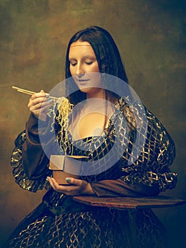 Young woman as Mona Lisa on dark background. Retro style, comparison of eras concept.