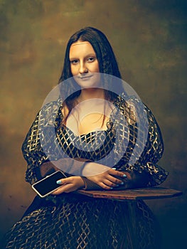 Young woman as Mona Lisa on dark background. Retro style, comparison of eras concept.