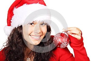 Young woman as santa with red christmas bauble