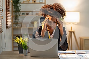 Young woman asian employee feeling tired stressed concern nervous serius with her work in the office, sad working woman photo