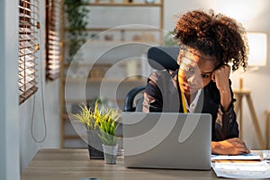 Young woman asian employee feeling tired stressed concern nervous serius with her work in the office, sad working woman photo