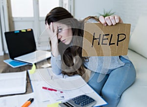 Young woman asking for help suffering stress doing domestic accounting paperwork bills