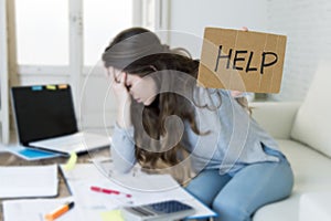 Young woman asking for help suffering stress doing domestic accounting paperwork bills