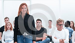 Young woman asks a question during a business seminar.