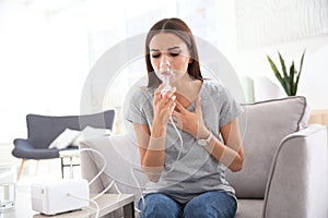 Young woman with asthma machine