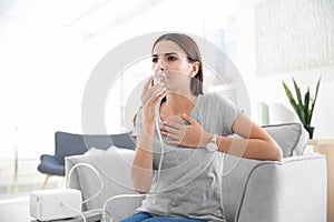 Young woman with asthma machine