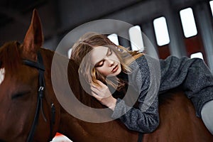 Young woman astride a horse