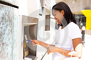 Young woman at the ATM photo