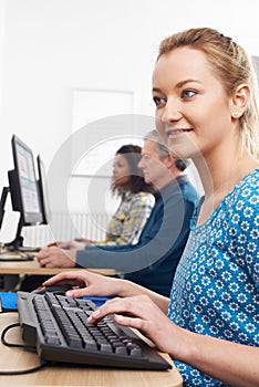 Young Woman Attending Computer Class