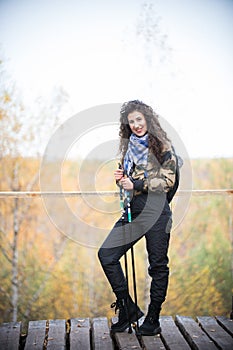 Young woman with attributes for nordic walking