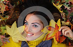 Young Woman with autumn leaves