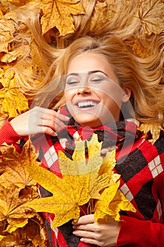 Young woman with autumn leaves