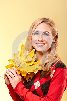 Young woman with autumn leaves