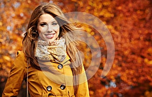 Young woman with autumn leaves