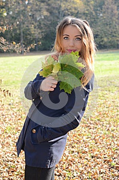 Young woman in autumn park