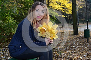 Young woman in autumn park