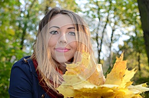 Young woman in autumn park