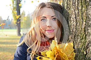 Young woman in autumn park