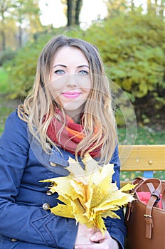 Young woman in autumn park