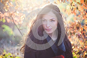 young woman autumn portrait in warm clothes outdoor natural light