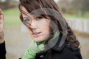 Young woman in autumn with a scarf