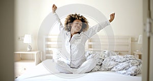 Young Woman Awaking On The Bed