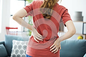 Young woman with back pain