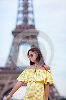Young woman background Eiffel Tower in Paris
