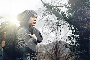 Young woman with backpack in forest. Concept Travel Tourism Adventure Hike and People