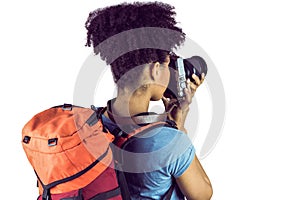 Young woman with backpack taking picture