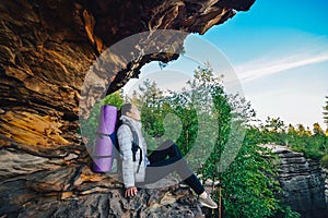 Young woman backpacker enjoy the view at mountain peak