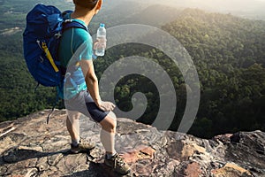 woman backpacker enjoy the view on mountain peak