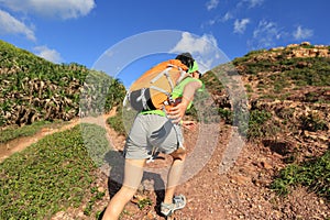 Young woman backpacker walking