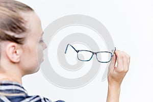 Young woman with bad eyesight with glasses and contact lenses