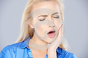 Young woman with bad tooth ache photo