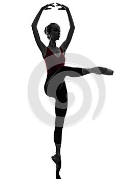 Young woman ballerina ballet dancer stretching warming up silho