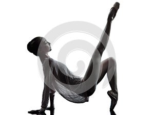 Young woman ballerina ballet dancer stretching warming up silho