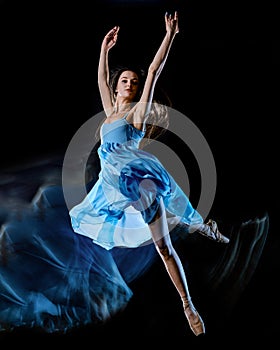 Young woman ballet dancer dancing isolated black background light painting