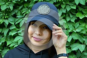 Young woman in a baseball cap