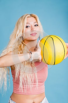 Young woman with a basket ball
