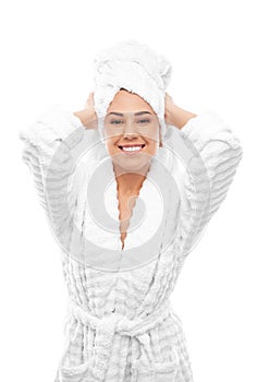 Young woman in a bathrobe and towel on her head