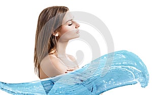 Young woman in bathrobe in water splashes.