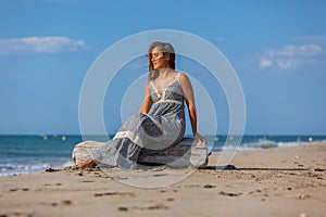 YOUNG WOMAN ON A BEACH