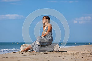 YOUNG WOMAN ON A BEACH