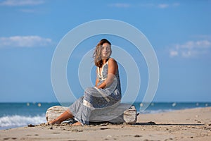 YOUNG WOMAN ON A BEACH