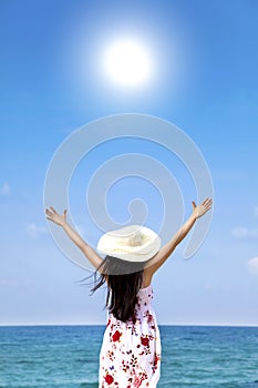 Young woman on the beach enjoy