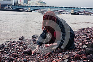 Young woman beachcombing in city