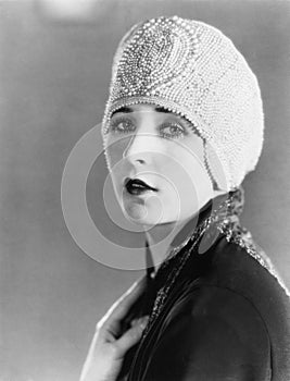 Young woman in beaded cap photo