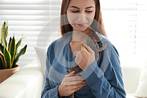 Young woman with bearded lizard. Exotic pet