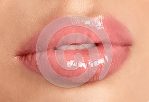 Young woman with beautiful full lips on background, closeup